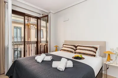 Cama o camas de una habitación en Waou Gran Via Studio I - Corta Duración