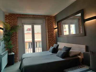 Cama o camas de una habitación en ººººEM Historical CityCentre WiFi AC SmartTVºººº
