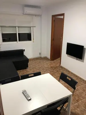 Una televisión o centro de entretenimiento en Apartamento céntrico bajo