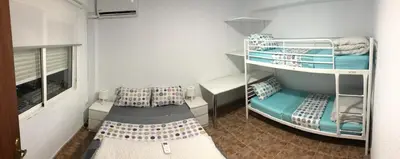 Cama o camas de una habitación en Apartamento céntrico bajo