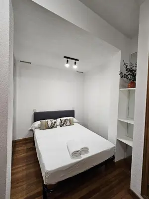 Cama o camas de una habitación en Apartamentos Sleep in Madrid