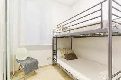 Cama o camas de una habitación en LEEWAYS APARTMENT VI in GRAN VÍA