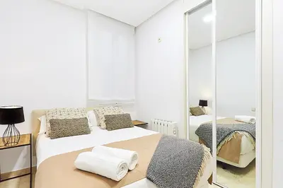 Cama o camas de una habitación en LEEWAYS APARTMENT XIX in GRAN VÍA