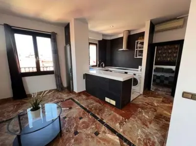 Una cocina o zona de cocina en Apartamentos El Tiempo