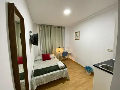 Cama o camas de una habitación en Apartamentos SmartRenting Justicia