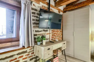 Una televisión o centro de entretenimiento en Apartamento Plaza de España 5