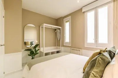 Cama o camas de una habitación en Apartamento Embajadores XI